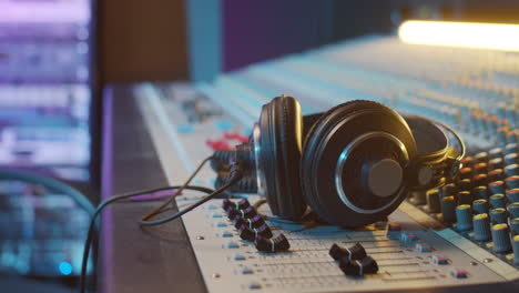 Headphones-on-Mixing-Console-in-Recording-Studio